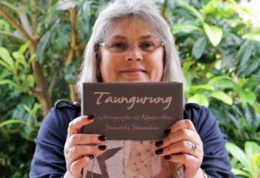 Aunty Lee Healy holding the Taungurung Dictionary. Photo © Jane Curtis